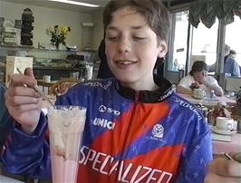 Eliot enjoys his Knickerbocker Glory at the Tasty Corner café, Looe